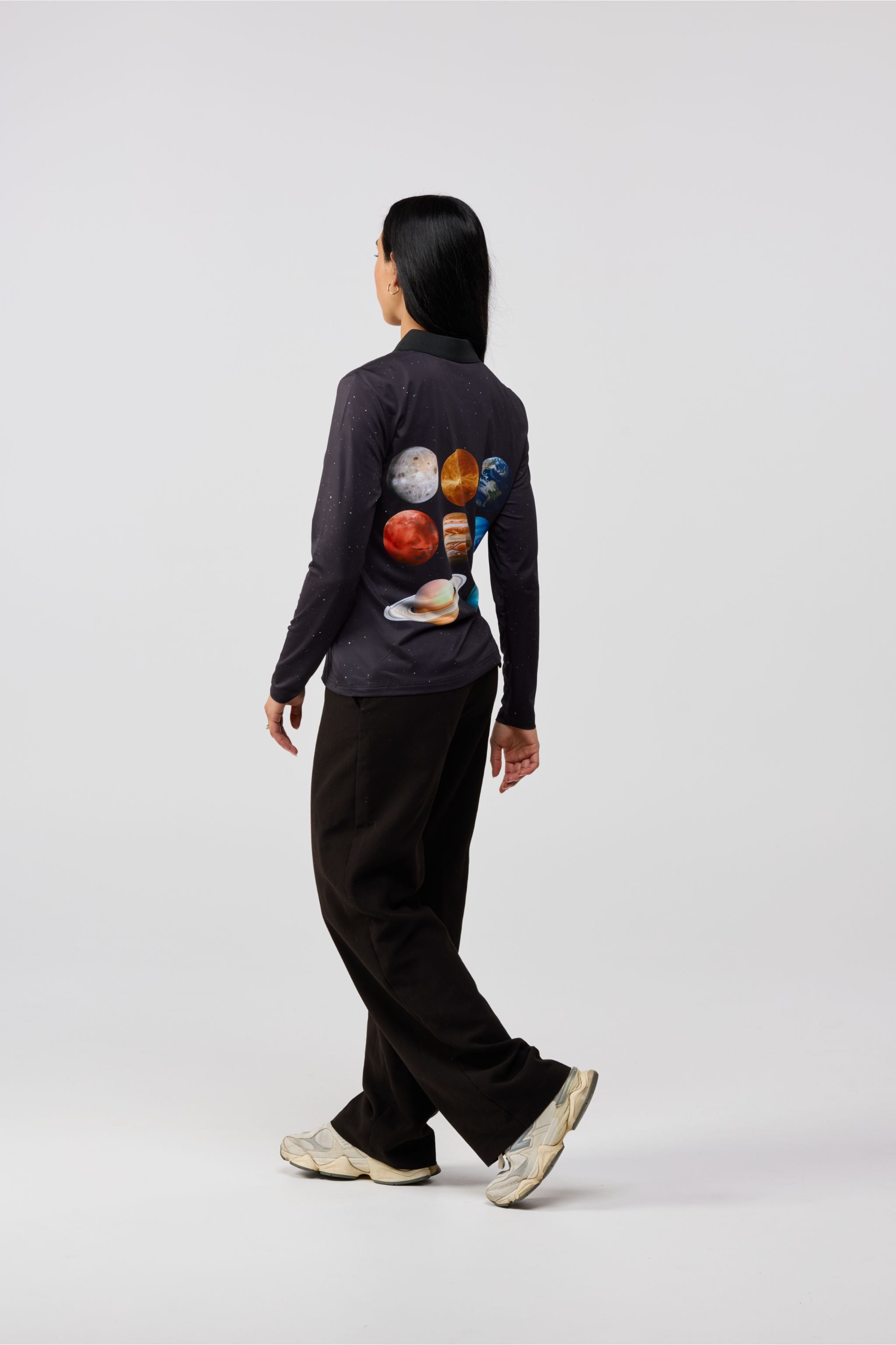 Back view of Solar Line black t-shirt featuring detailed planets of the solar system graphic.