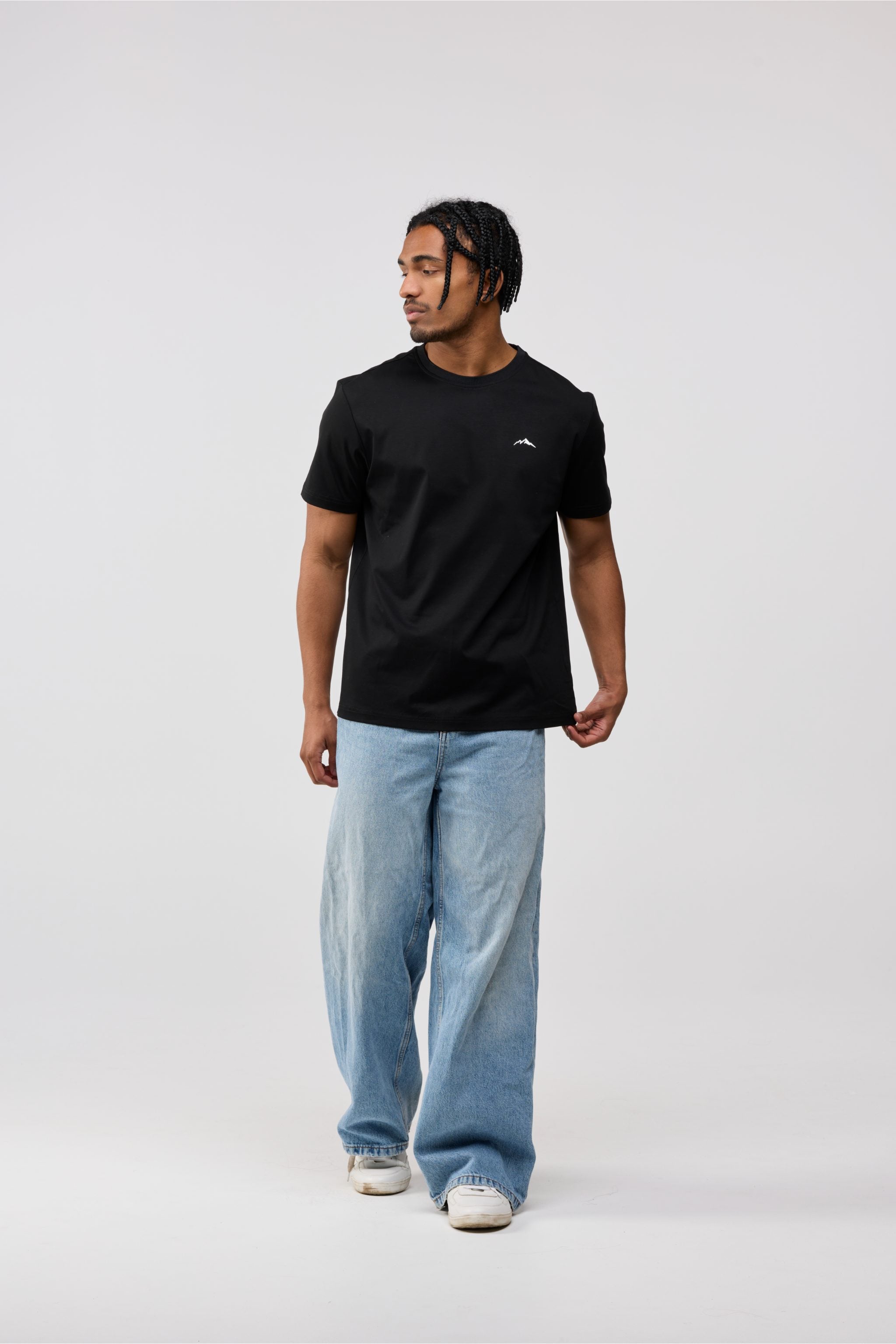 Close-up of front chest area showing fine stitching and soft cotton fabric texture.