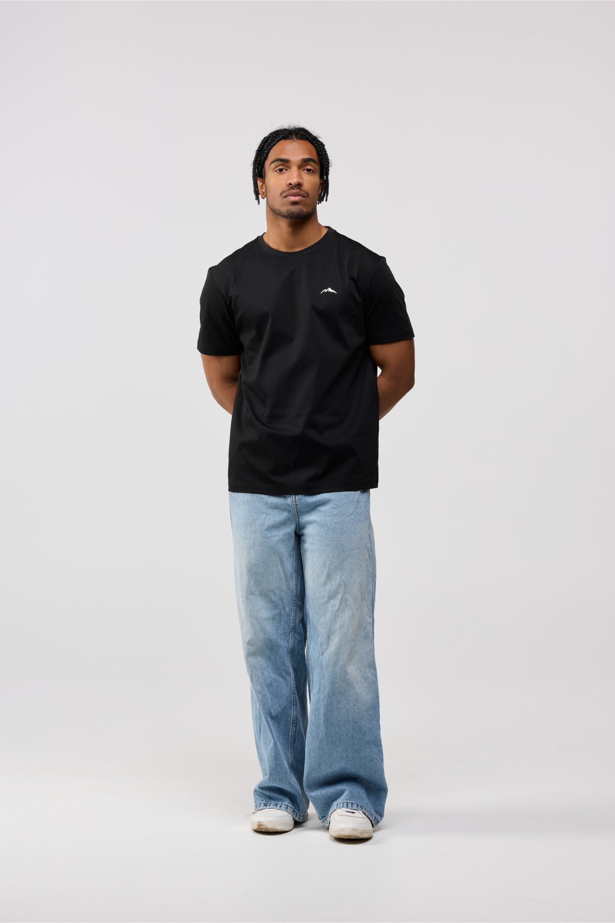 Front view of men’s black cotton crewneck t-shirt with classic short sleeve design.