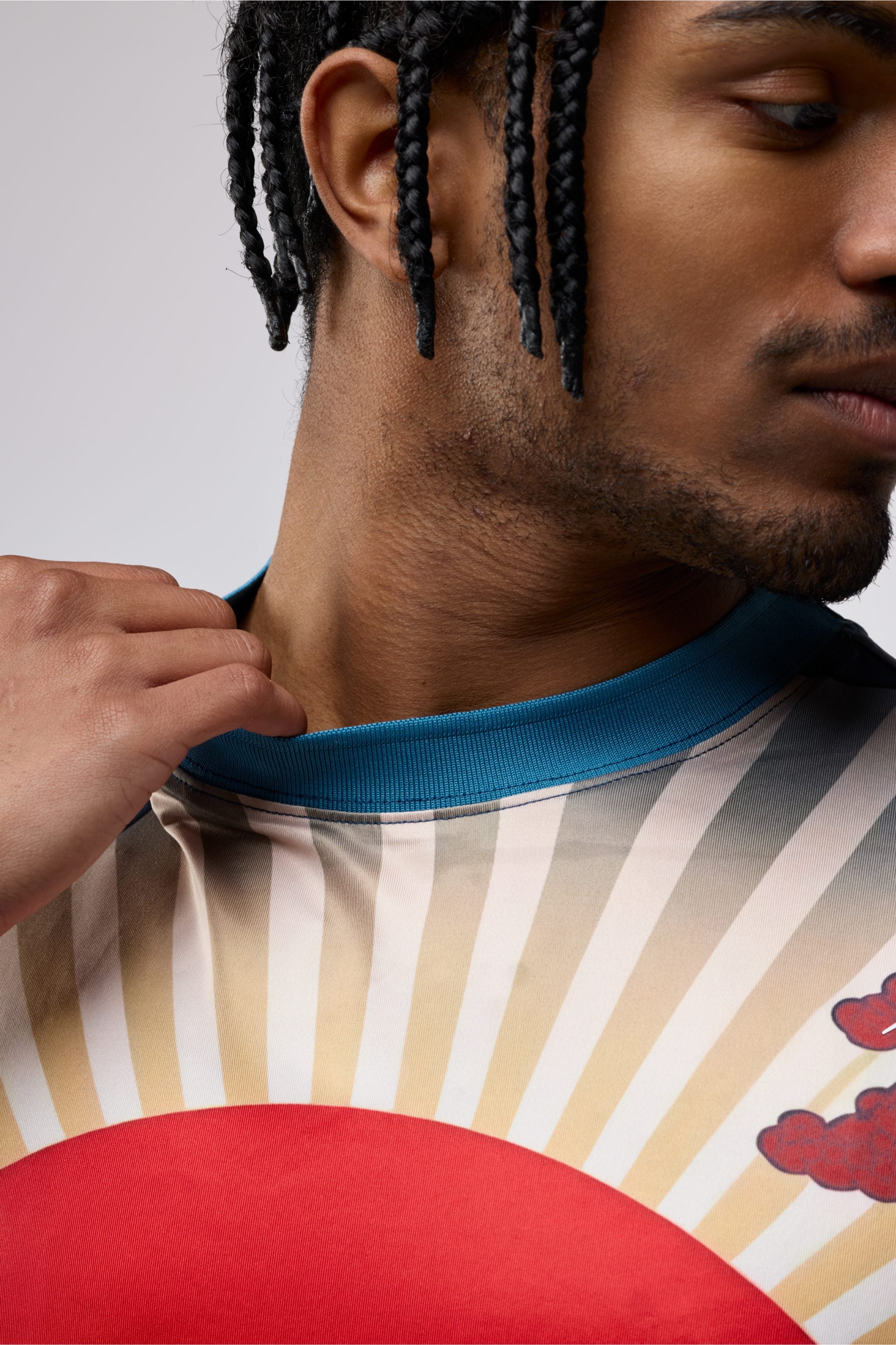 Close-up of Pacific Aura print and ribbed collar on men’s crewneck